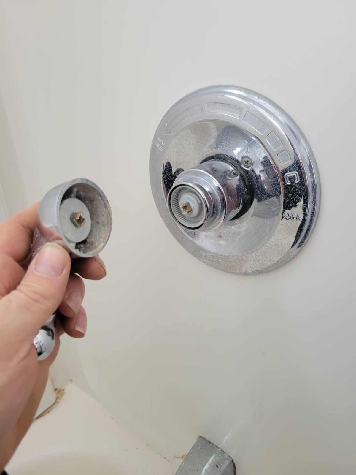 Shower valve cartridge being replaced during a Niagara Region shower repair