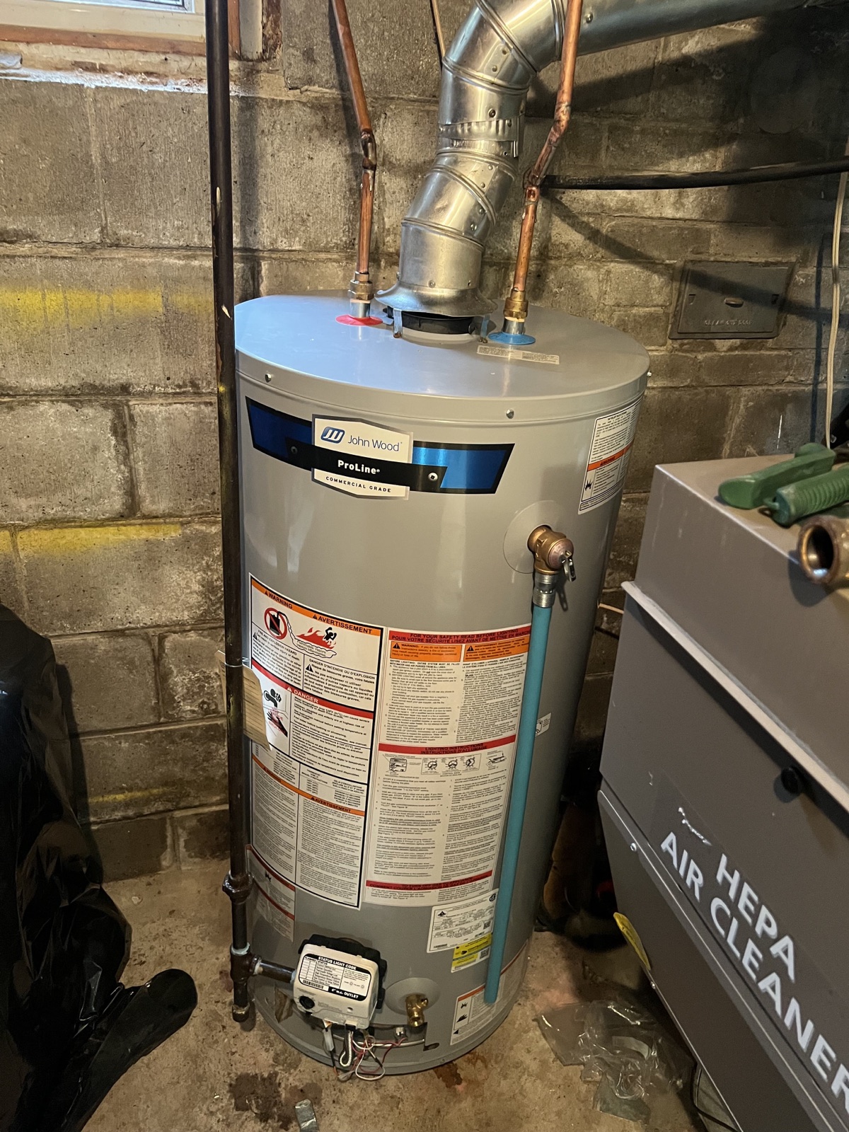 Residential tank water heater installed in a Niagara Region basement